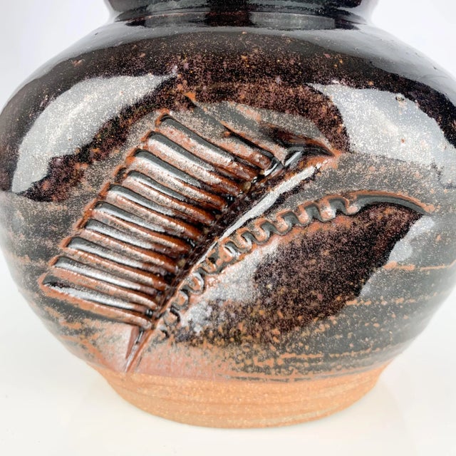Incredible signed vintage studio pottery vase. Love the colors and the texture. The accents. Signed but can’t make out the...