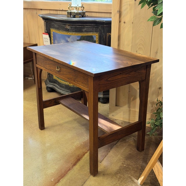 A handsome vintage Mission oak writing desk with strong Arts & Crafts and Craftsman character. The straightforward...