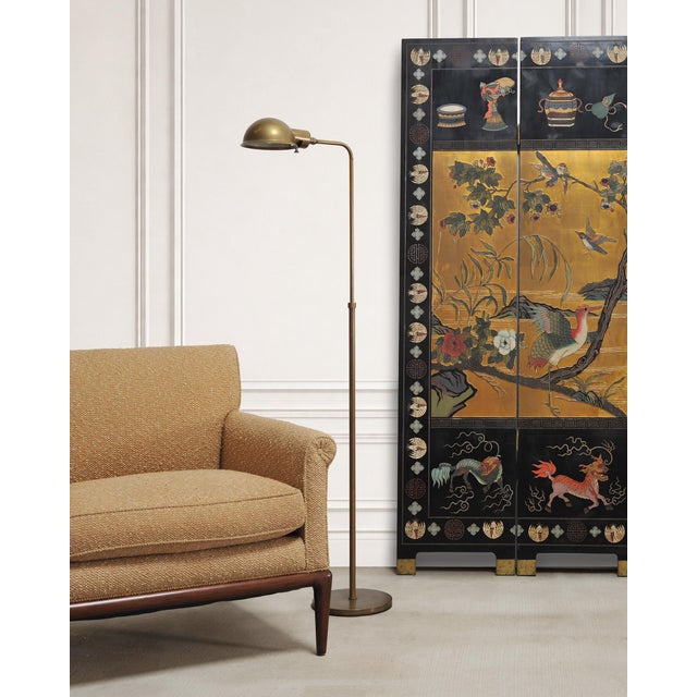 A classic mid-century modern style adjustable pharmacy floor lamp made in the style and manner of similar lamps by Koch &...