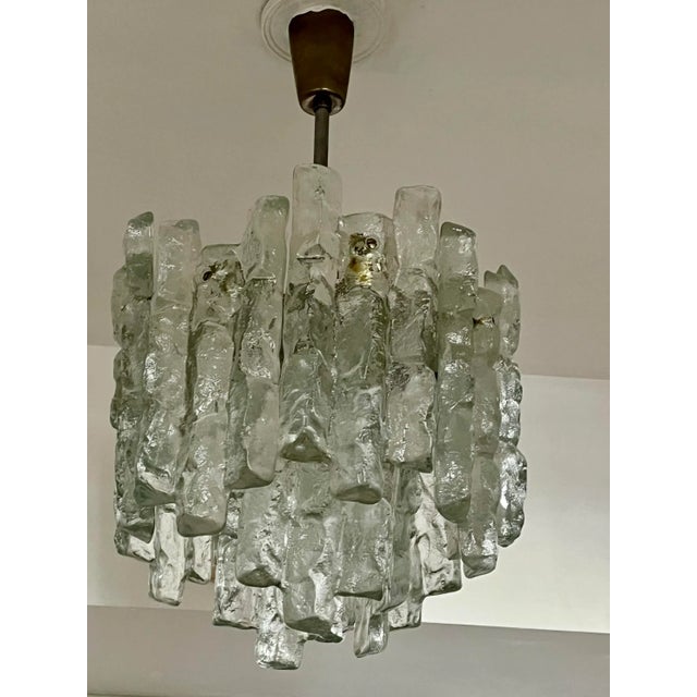 Vintage Kalmar chandelier with twelves glass plaques with ice motif--- nine sockets total. Each plaque measures 9/34...