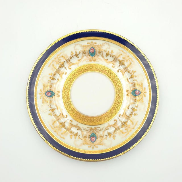 A fine set of twelve Limoges dinner plates, France circa 1920. One plate as-is.