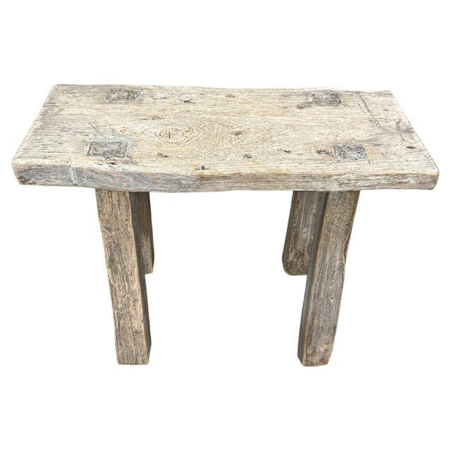 Beautiful patina on this antique single panel, natural aged teak wood bench or stool. Perfect for sitting on or as a...