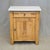 A charming antique European (German or Eastern European) rustic pine nightstand topped with a Carrara marble slab that is...