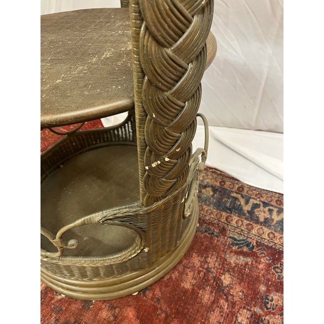 This is a wonderful vintage rattan tower shelf for displaying your fine collectibles in the round. There are 4 shelves...