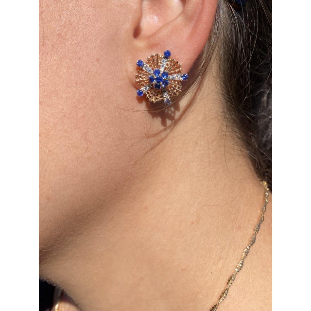 The 81st Street: Antique Sapphire and Diamond Clip Earrings. These exquisite earrings feature a central cluster comprising...