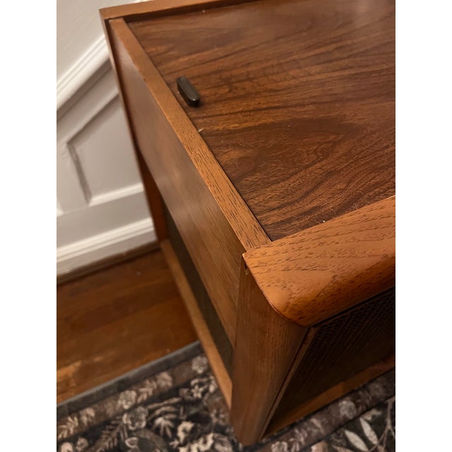 1960s Magnavox Astro-Sonic Mid-Century Modern Stereo Console. This classic piece features a rich walnut wood cabinet,...
