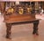 Crafted in France circa 1850, this antique oak bench is designed in the Renaissance Revival, or Henri II style, showcasing...