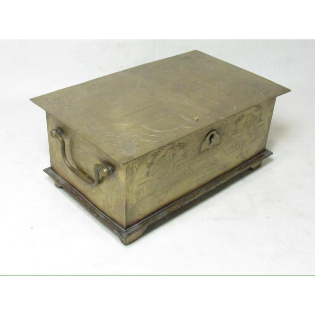 Antique Chinese brass box, c.1900 Rectangular in shape with hand carved decoration on all surfaces. Showing figures in a...
