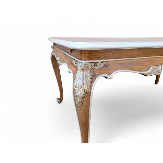 This elegant coffee table is a refined example of traditional Italian craftsmanship, crafted entirely from solid walnut....