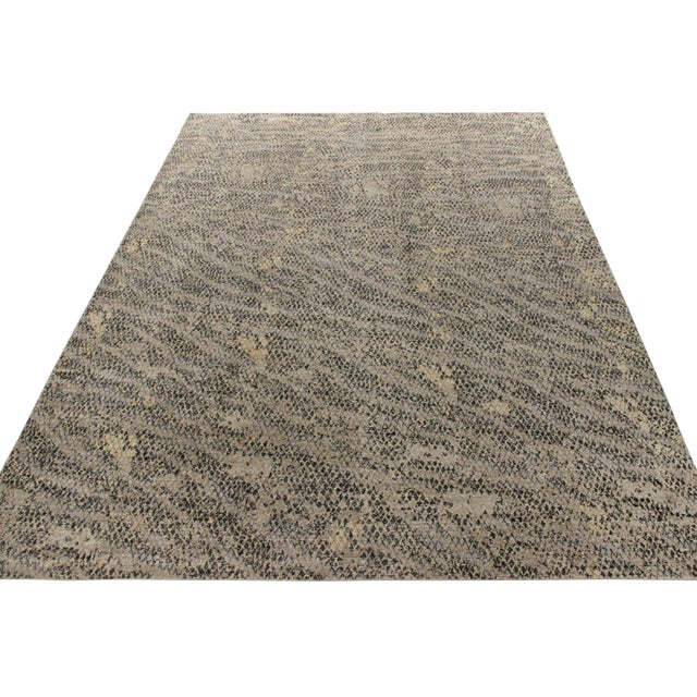 A 10x14 hand-knotted rug in distressed style from Rug & Kilim’s Homage Collection. This modern frame carries the hallmark...