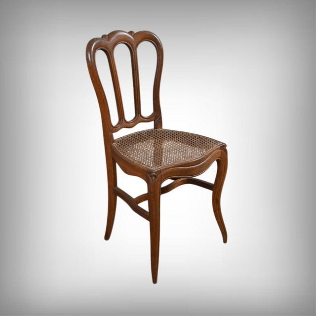 This elegant set of four Louis XV style chairs in solid oak captivates with its timeless charm and exquisite...