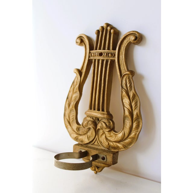 Exception French Louis XIV candle sconces in the shape of a harp instrument. Includes two unscented glass candle votives....