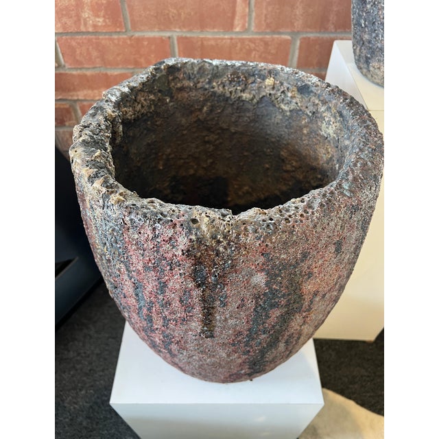 Vintage crucible, repurposed as unique planter or pot, carries the marks of their industrial past while offering a...