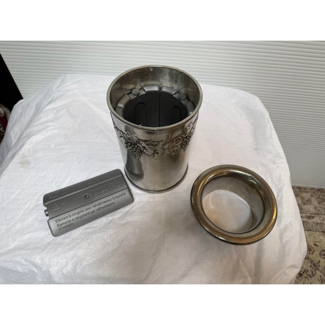 Design Plus Gallery presents a Set of Three German Wine Bottle Cooler in Casted Pewter. The outside of the bucket has a...