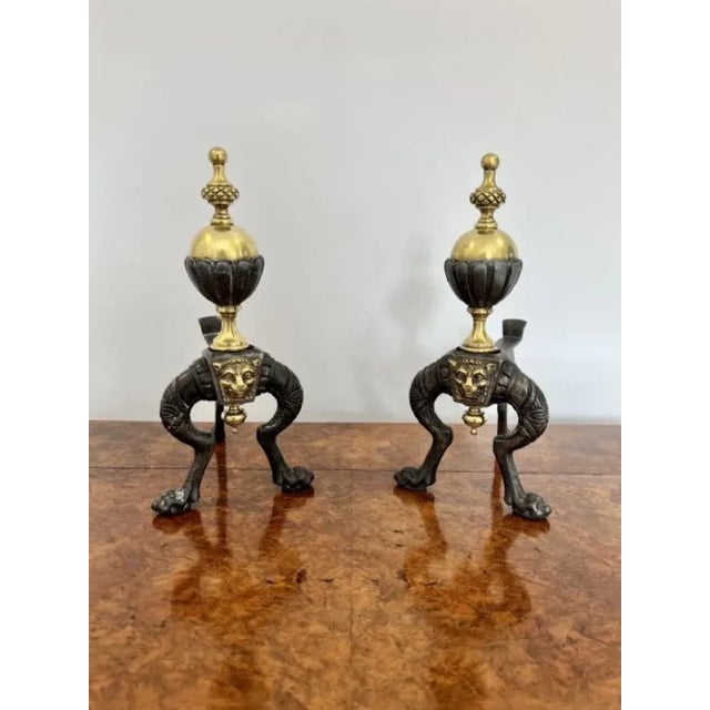 Pair of quality antique Victorian brass and iron fire dogs having a quality pair of brass and iron fire dogs with turned...