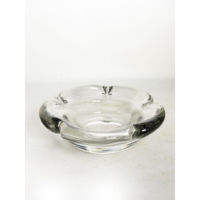 A crystal trinket tray signed Daum, France, circa 1970, of remarkable quality and substantial weight, attesting to the use...