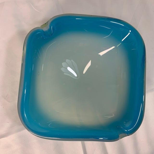 This stunning vintage piece is a Mid-Century Modern Murano art glass sommerso bowl / ashtray, historically crafted in...