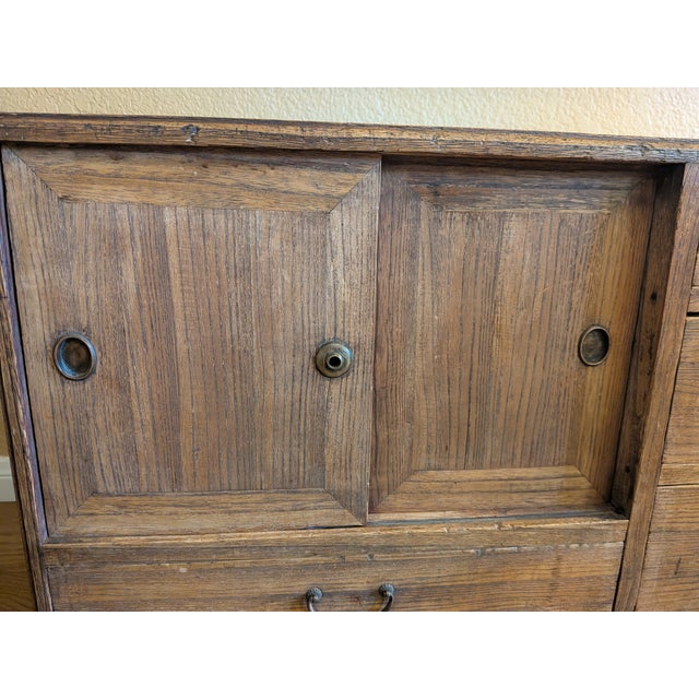 A beautifully aged Japanese ko-tansu (small merchant chest) dating to the late Meiji to early Taishō period, circa...