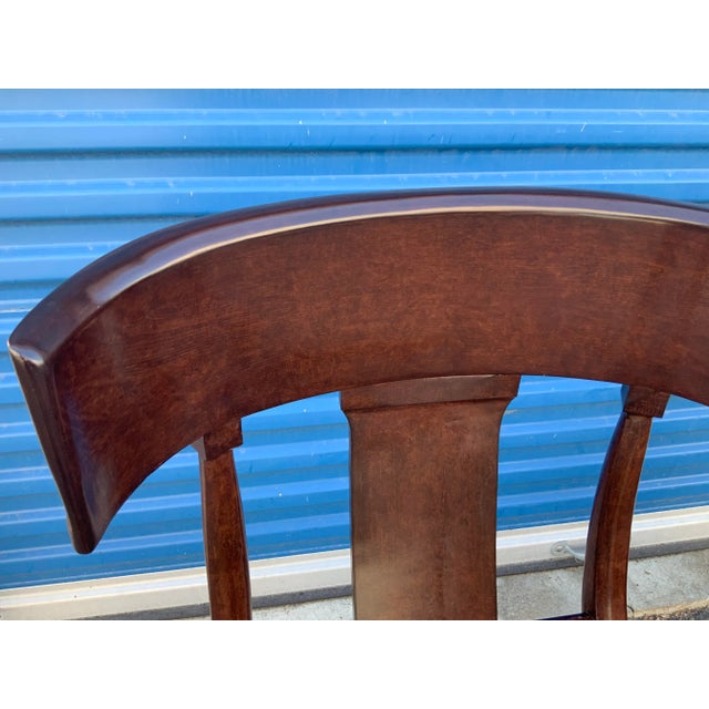 Modern mid century style Klismos chairs. The chairs have a custom copper finish. The chairs are made of alder. The chairs...