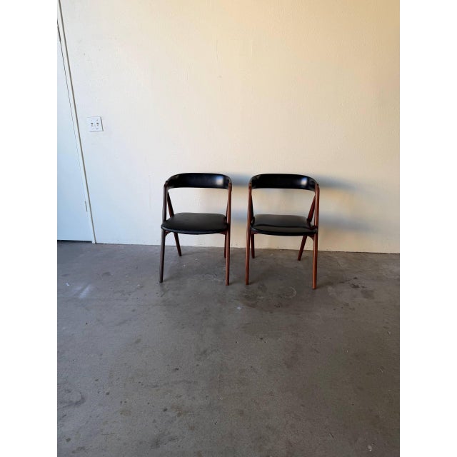 Elegant Danish Mid-Century Modern dining chairs designed in style of Thomas Harlev for Farstrup Møbler. Crafted from solid...