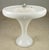 Vintage Art Deco porcelain enameled cast iron pedestal sink with a minimalist curved base. This piece was originally...