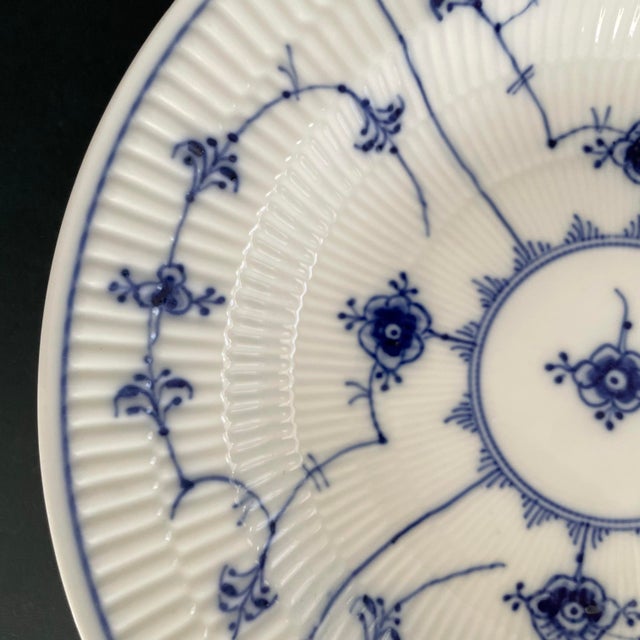 A vintage soup bowl by Royal Copenhagen. The bowl was created circa 1956. The soup bowl measures 9.75 by 1.75 inches tall....