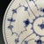 A vintage soup bowl by Royal Copenhagen. The bowl was created circa 1956. The soup bowl measures 9.75 by 1.75 inches tall....