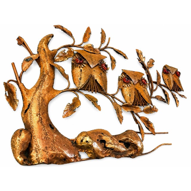 A wonderfully expressive vintage Brutalist mixed-metal wall sculpture depicting a family of four owls perched among...