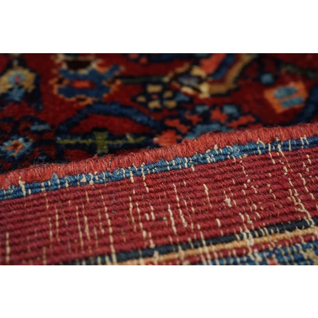 This well-woven, very compact Kurdish city carpet displays a red ground densely covered by a small-scale allover Herati...