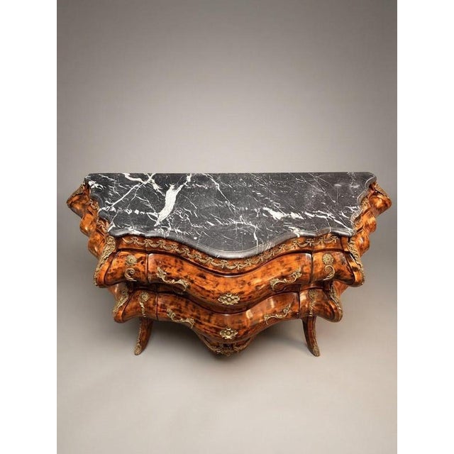Elevate your interior space with this striking French-style large bombé chest of drawers, designed with a beautifully...