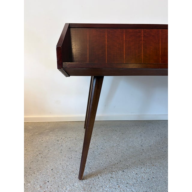 A desk * Presumably from Germany. No manufacturer's mark. * A beautiful example of classic mid-century design from the...