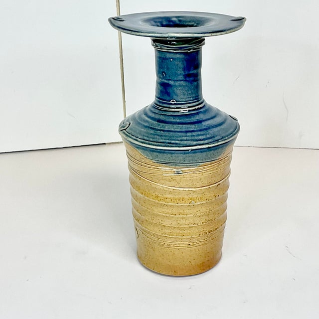 Dramatic style and shape is what you are drawn to with this Americana Folk Art Studio Pottery Vase. It has a wide upper...