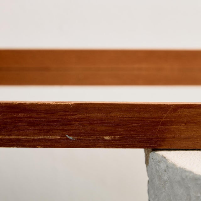 Classic-lined longish teak framed mirror from the 1960s. with some surface scratches, stains and wear on the wooden and...