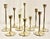 Imagine transforming your living space with this exquisite set of 10 Vintage Mid Century Modern Brass Tulip Candlestick...