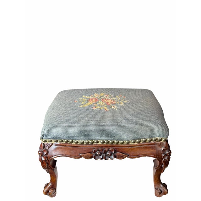 For sale is a very nice elegant vintage carved wood foot stool with a needlepoint top