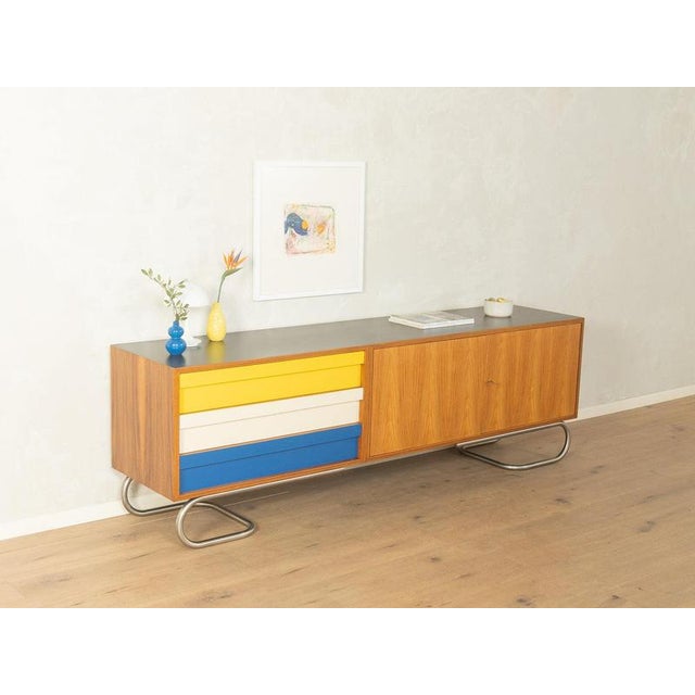 Exclusive Mid-Century Sideboard accomplished design: perfect proportions and discernible attention to detail high-quality...