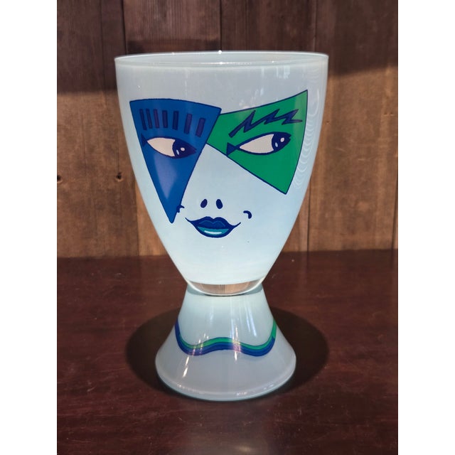 Ritzenhoff J. Kustosch art glass chalice or goblet features a striking pop art face design in vibrant blue and green tones...