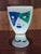 Ritzenhoff J. Kustosch art glass chalice or goblet features a striking pop art face design in vibrant blue and green tones...
