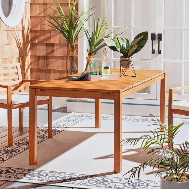 Bold and beautiful, this contemporary outdoor dining table was designed for entertaining with form and function. Perfect...