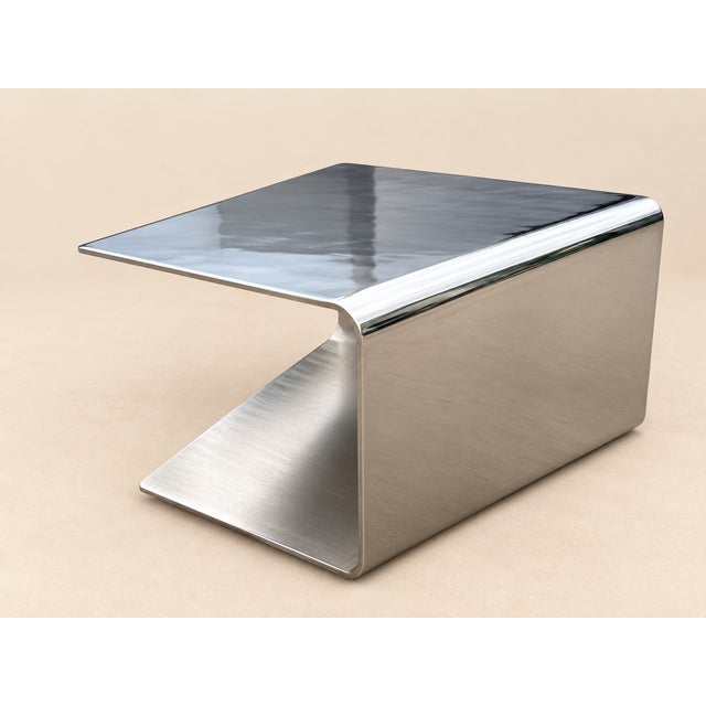 Monumental Sculptural Polished Stainless Steel Cantilever Coffee Table, about 3/8 thick stainless. Top is polished, lower...