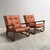 Set Danish arm chairs from the 1970s. Bamboo / manou frames with cognac leather cushions. Chairs are good condition with...