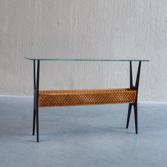 An exceptional 1950s Italian Mid-Century Modern console table featuring sculptured, dynamic lines and high-quality...