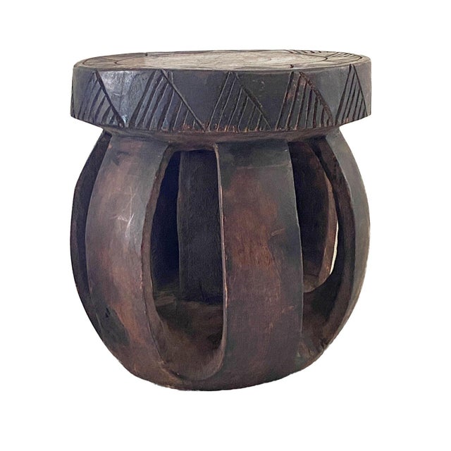 Superb hand-carved low stool crafted from a single piece of heavy solid wood by the Baga people of Guinea-Bissau. While...
