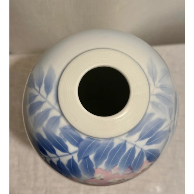Imagine adding a touch of elegance to your home with this stunning 20th Century Fukagawa Porcelain Vase. Featuring a...