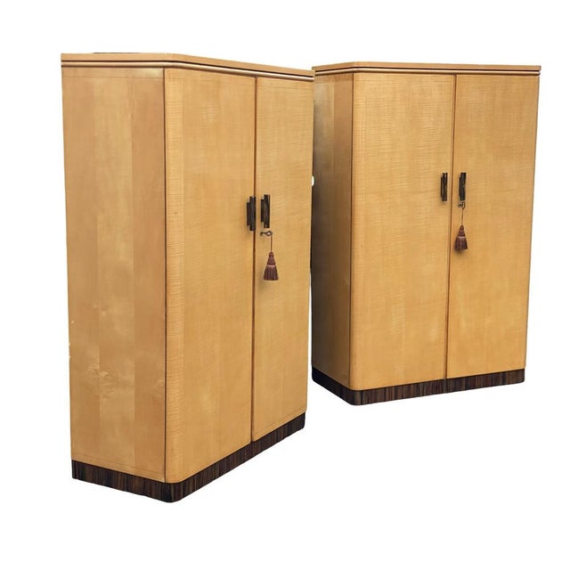 A glorious pair of matching Art Deco Wardrobes, dating to the 1930s, in a lovely warm blonde sycamore with the tiniest of...