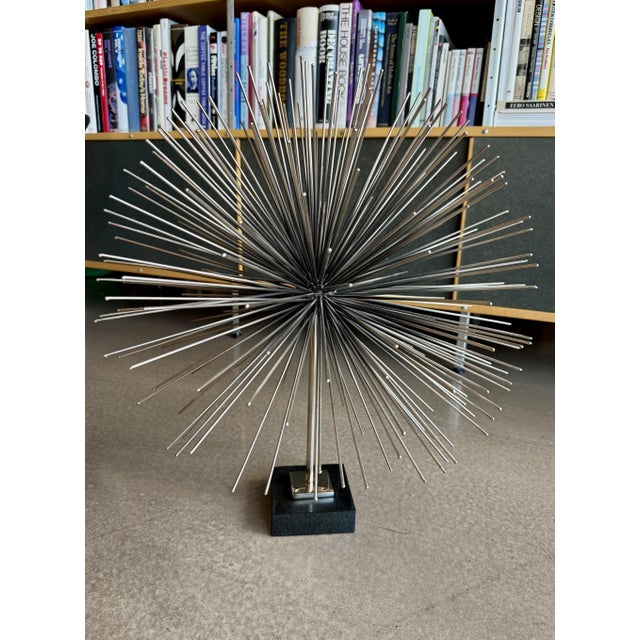 Large modern brutalist metal urchin/sputnik sculpture manufactured by Global Views and executed with design elements...