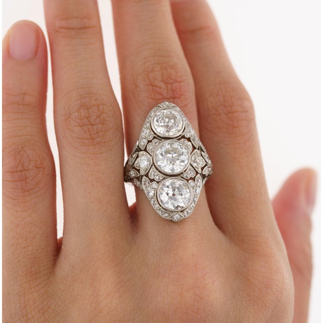 Original Vintage Art Deco "Top River" Old-European Cut Diamond Ring In Platinum. This gorgeous ring features 3 bezel set...