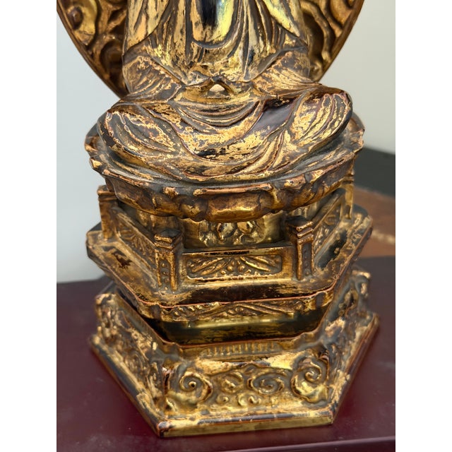 A striking mid-20th century Japanese carved wooden Buddha, dating approximately to the 1950s–1960s, richly finished with...