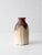 This vintage handmade studio pottery vase features a wheel-thrown form with softly faceted sides and layered cream and...