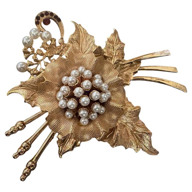 This exquisite vintage brooch is a standout piece of Italian costume jewelry, likely dating from the early 2000s. It...